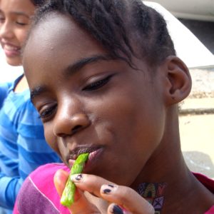 Girl eating asparagus