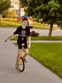 Boy on a unicycle