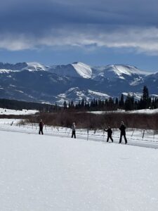 Family Cross country skiing in mountains