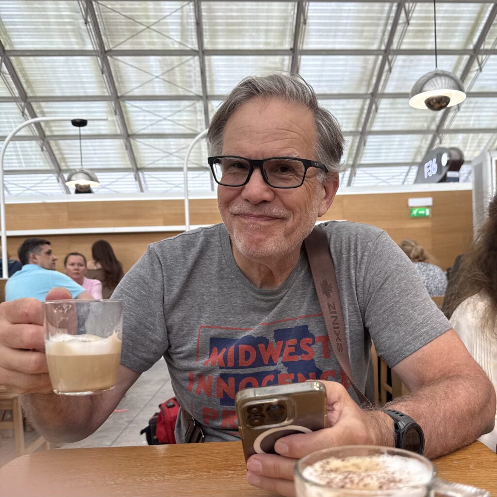My brother Dave enjoying a coffee in Charles de Gaulle Airport, Paris
